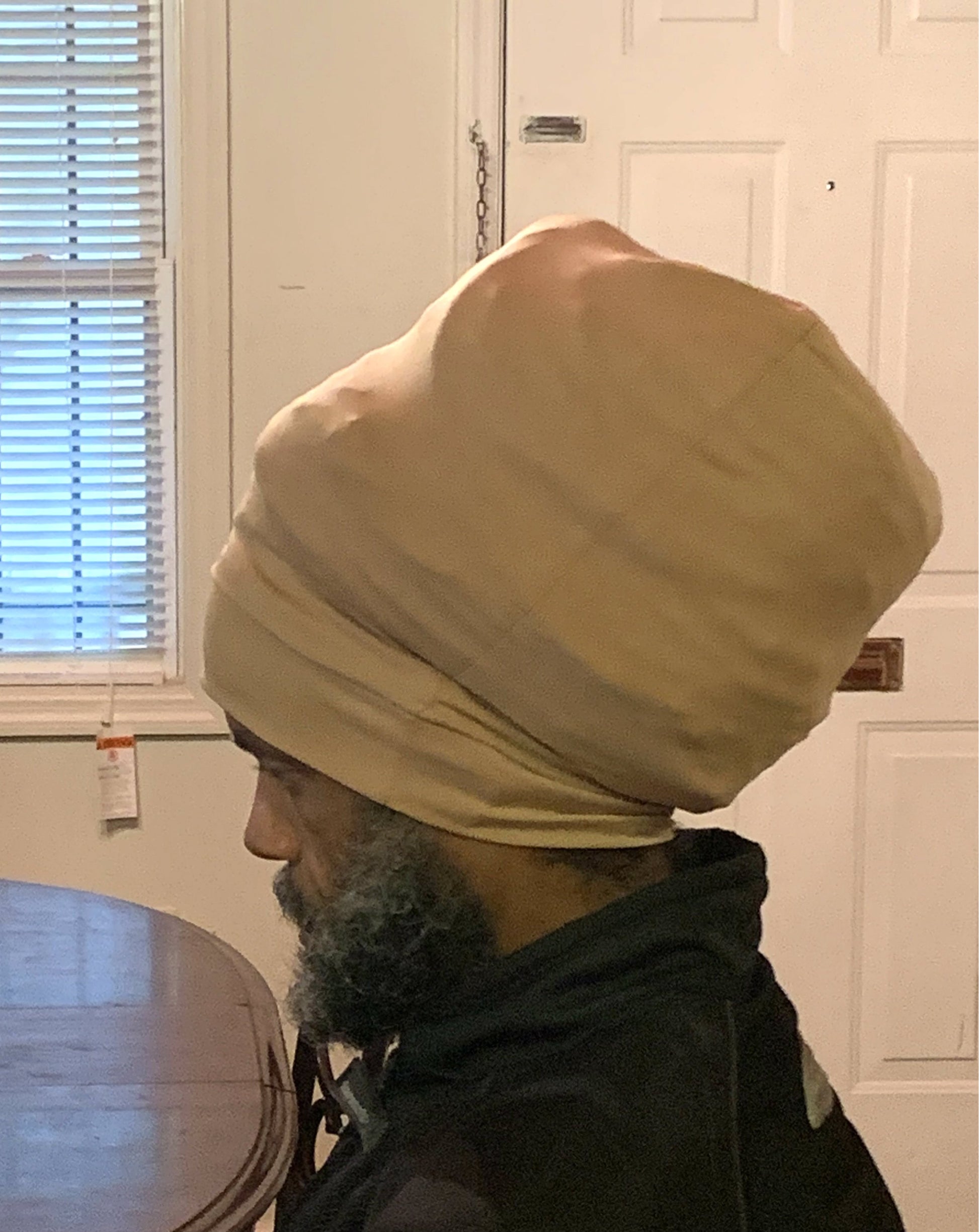Tan stretch hat - side view.