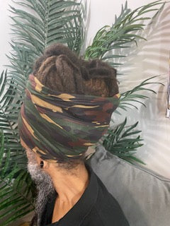Back View - Man wearing a dark camouflage turban with an open top. Available in different lengths from 10" to 18".