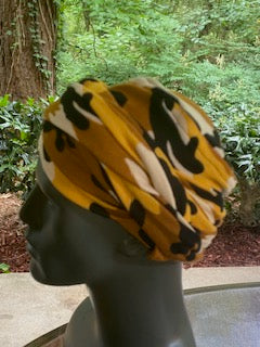 Left View - Dark camouflage turban for men with bald head, comes with two long bands, so you just slip the turban on your head and wrap the bands as desired.