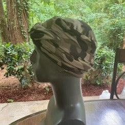 Left View - Dark camouflage turban for men with bald head, comes with two long bands, so you just slip the turban on your head and wrap the bands as desired.