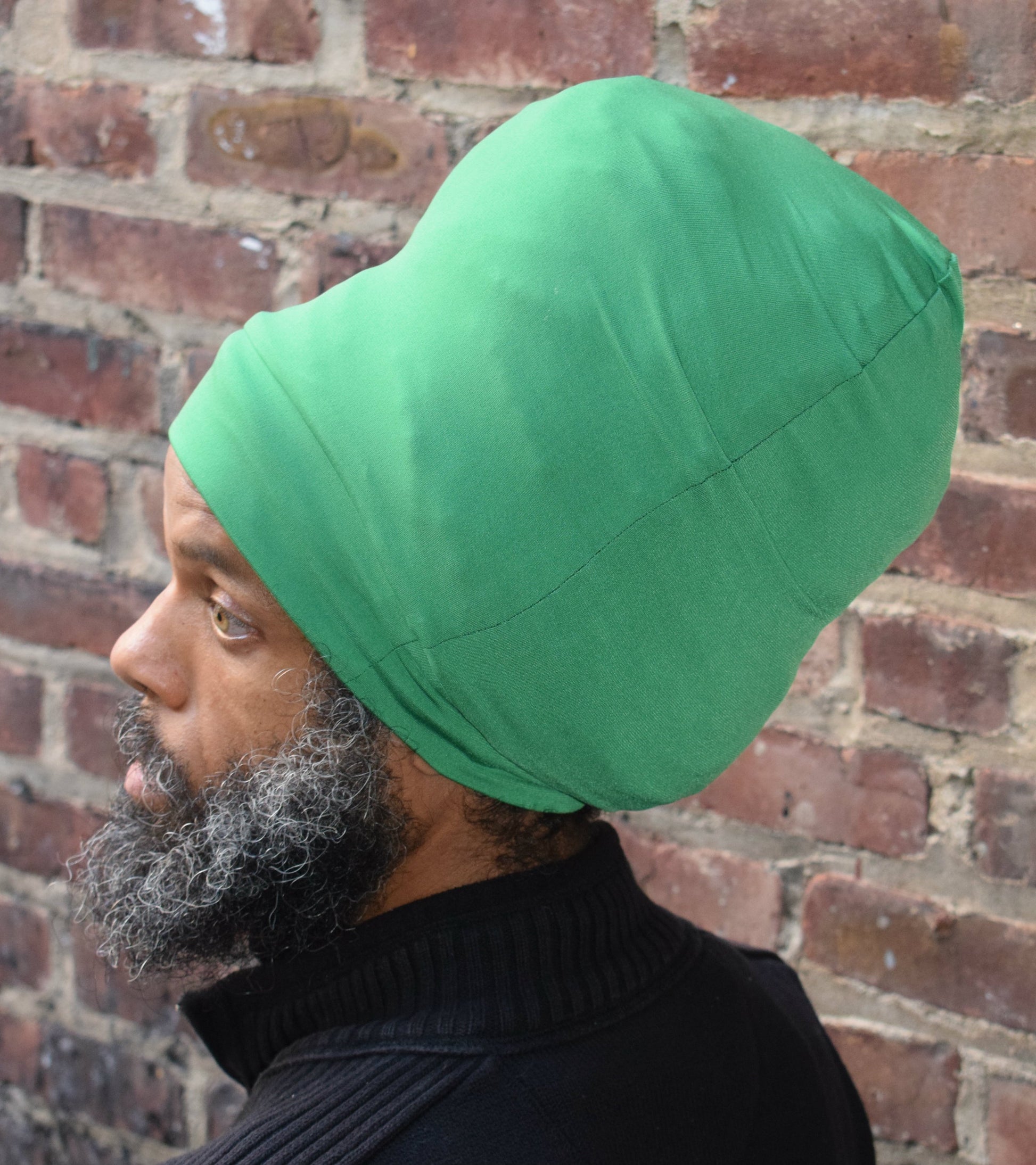Emerald Green stretch hat - side view.